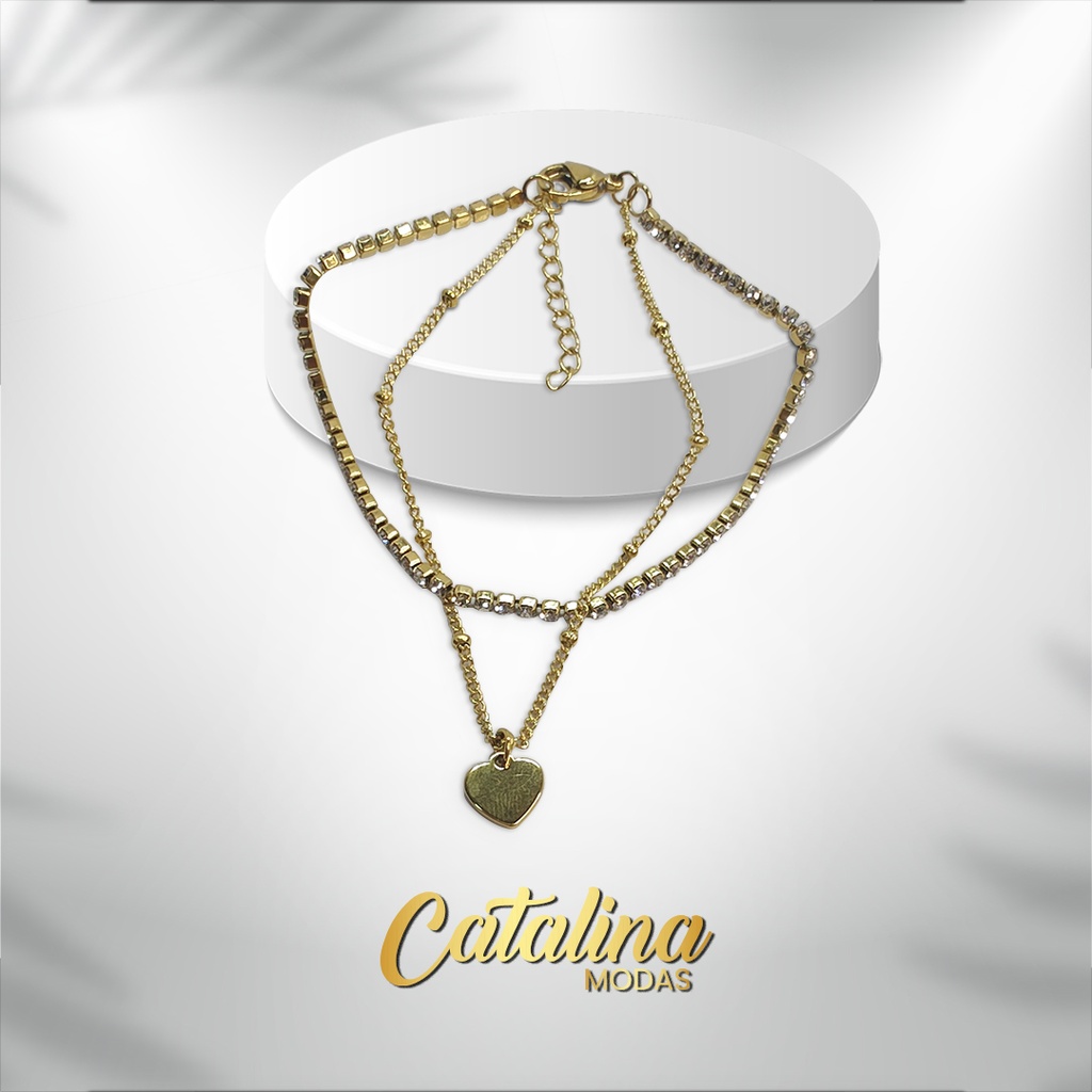 Pulsera doble con dije de corazón. Acero dorado